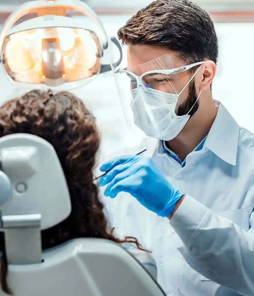 Dentist performing a dental check in Naperville IL