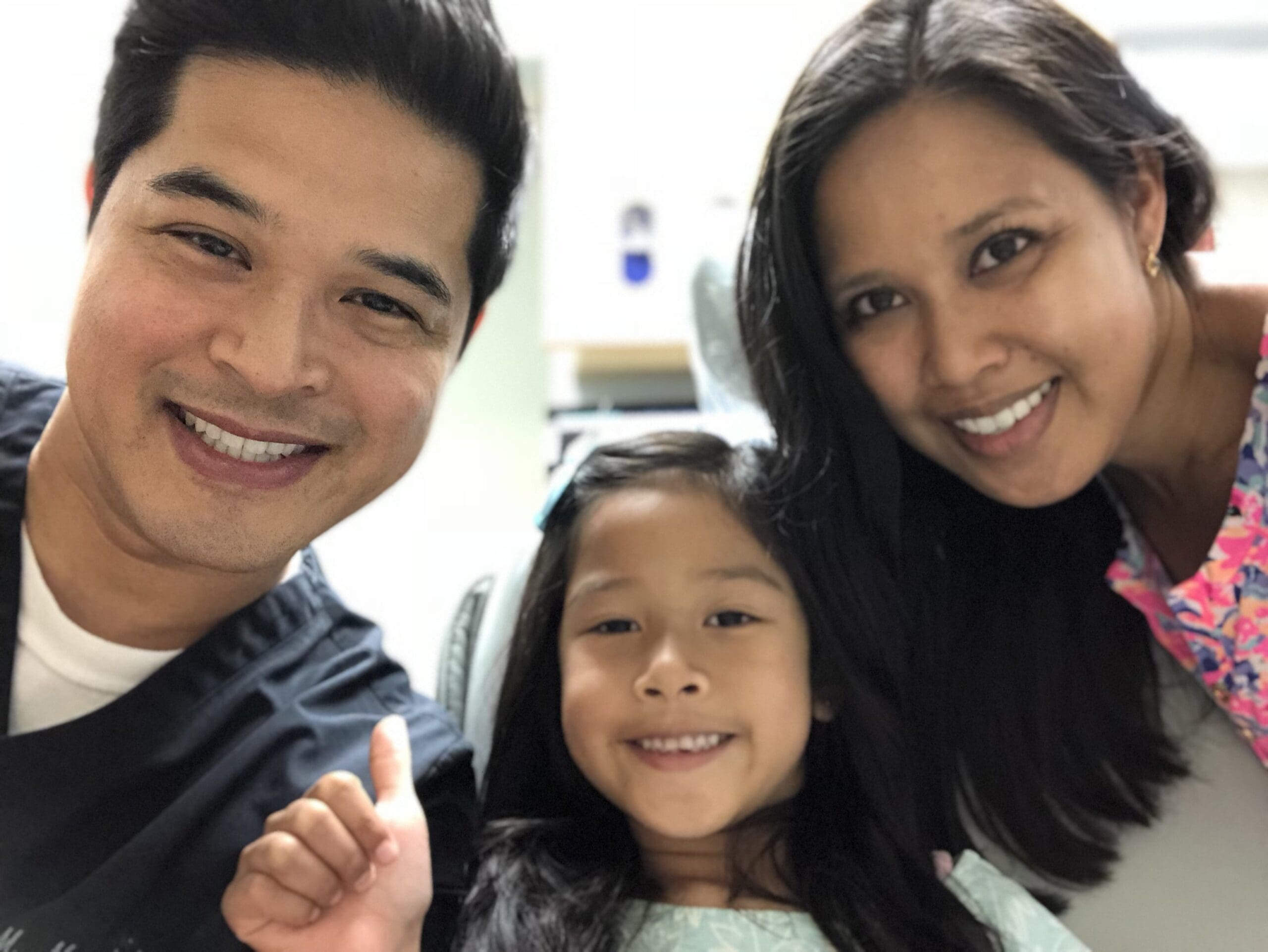 Parents with daughter and Pebblewood Dental